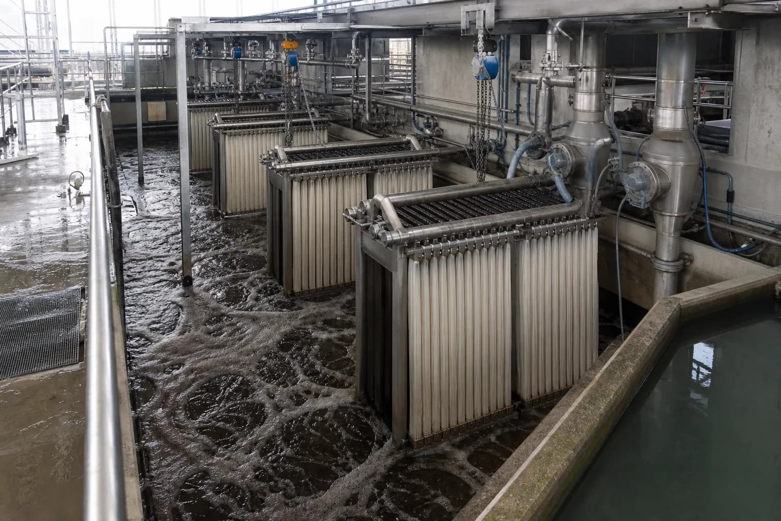 How does an MBR separate sludge from water?